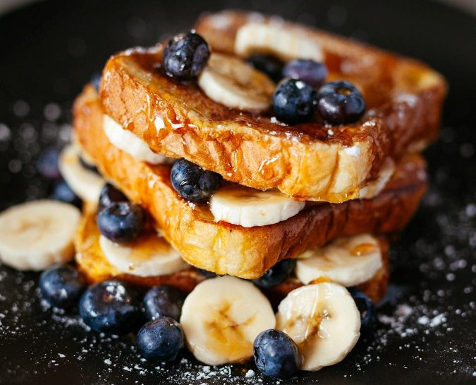 french toast with bananas and blueberries