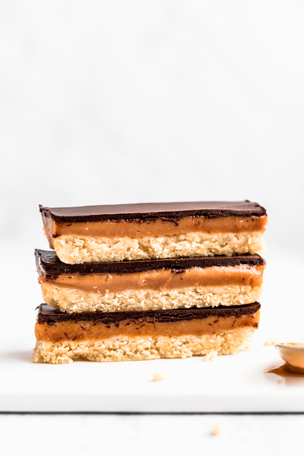 three healthy homemade twix bars stacked on top of eachother