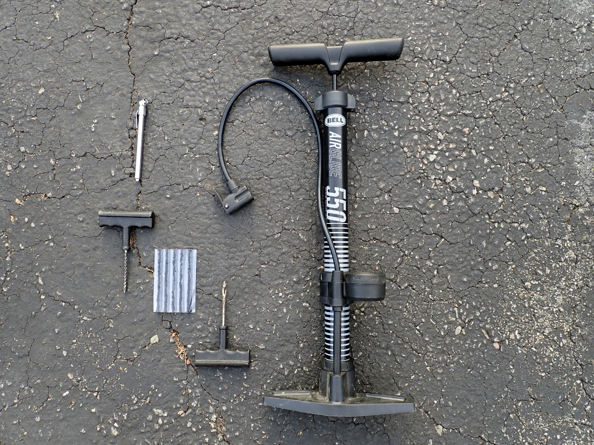 Tire pressure gauge, plug kit, pump.