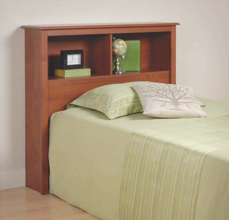 the headboard of the wood bed