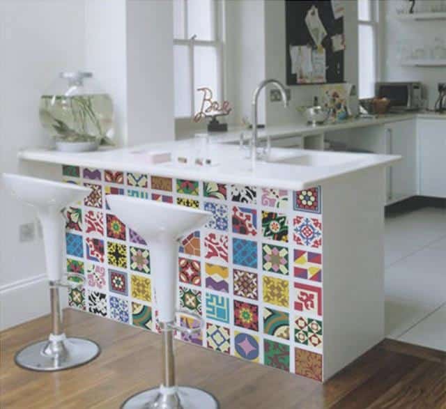 The countertop of the kitchen is a modern with the colorful tiles