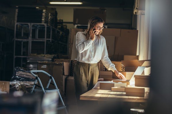 woman in her store comparing Shopify vs WordPress for her online business