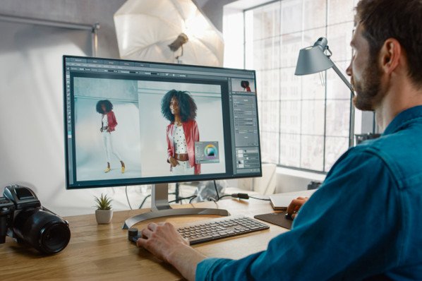 editing photos to add to his photography wordpress theme