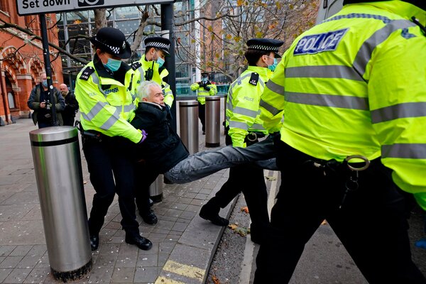 Police arrest a protester during an anti-lockdown demonstration in London on Saturday. 