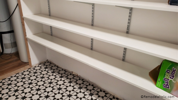 Basement Storage Room With Tile Floor And Track Shelving Storage, Remodelaholic (1)