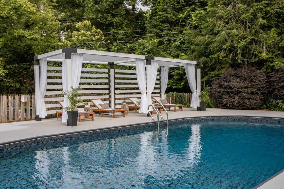 pool makeover with DIY pergola cabana and painted concrete