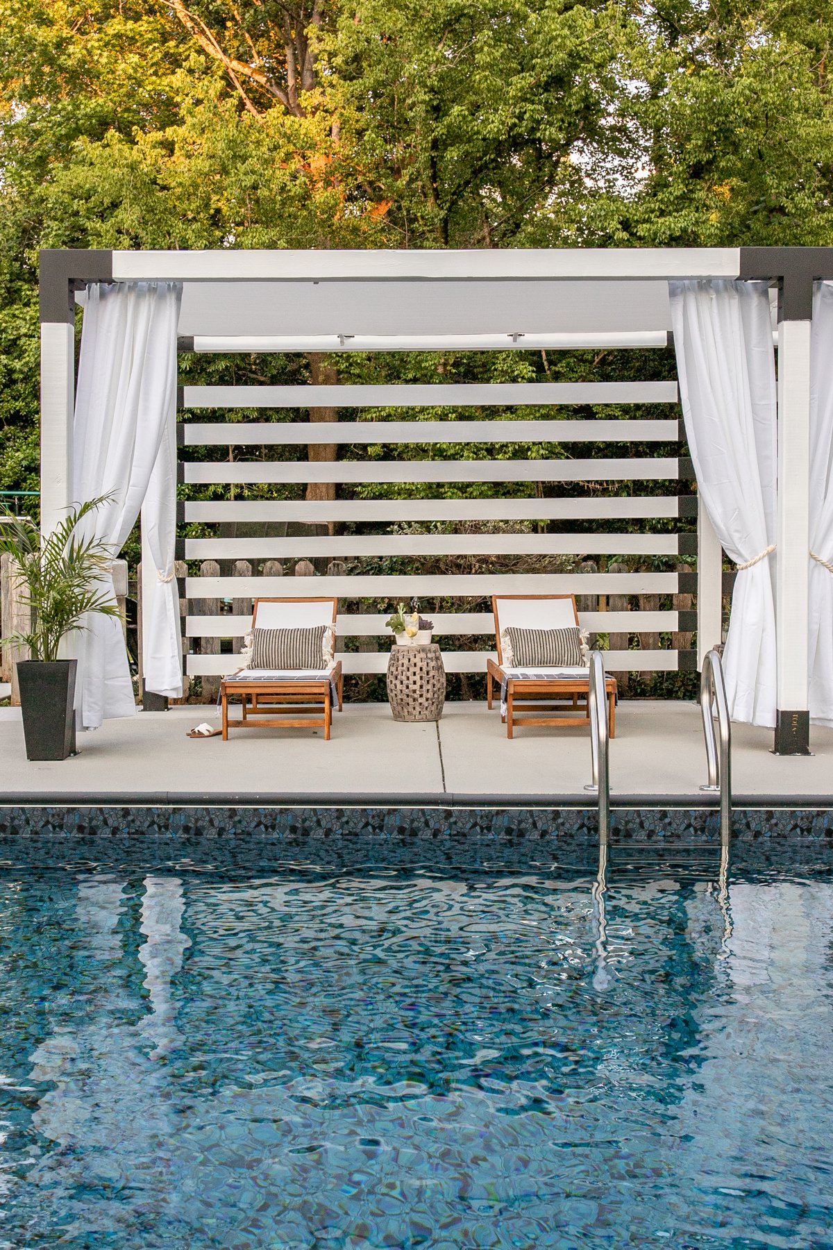 backyard pergola poolside cabana with white outdoor curtains