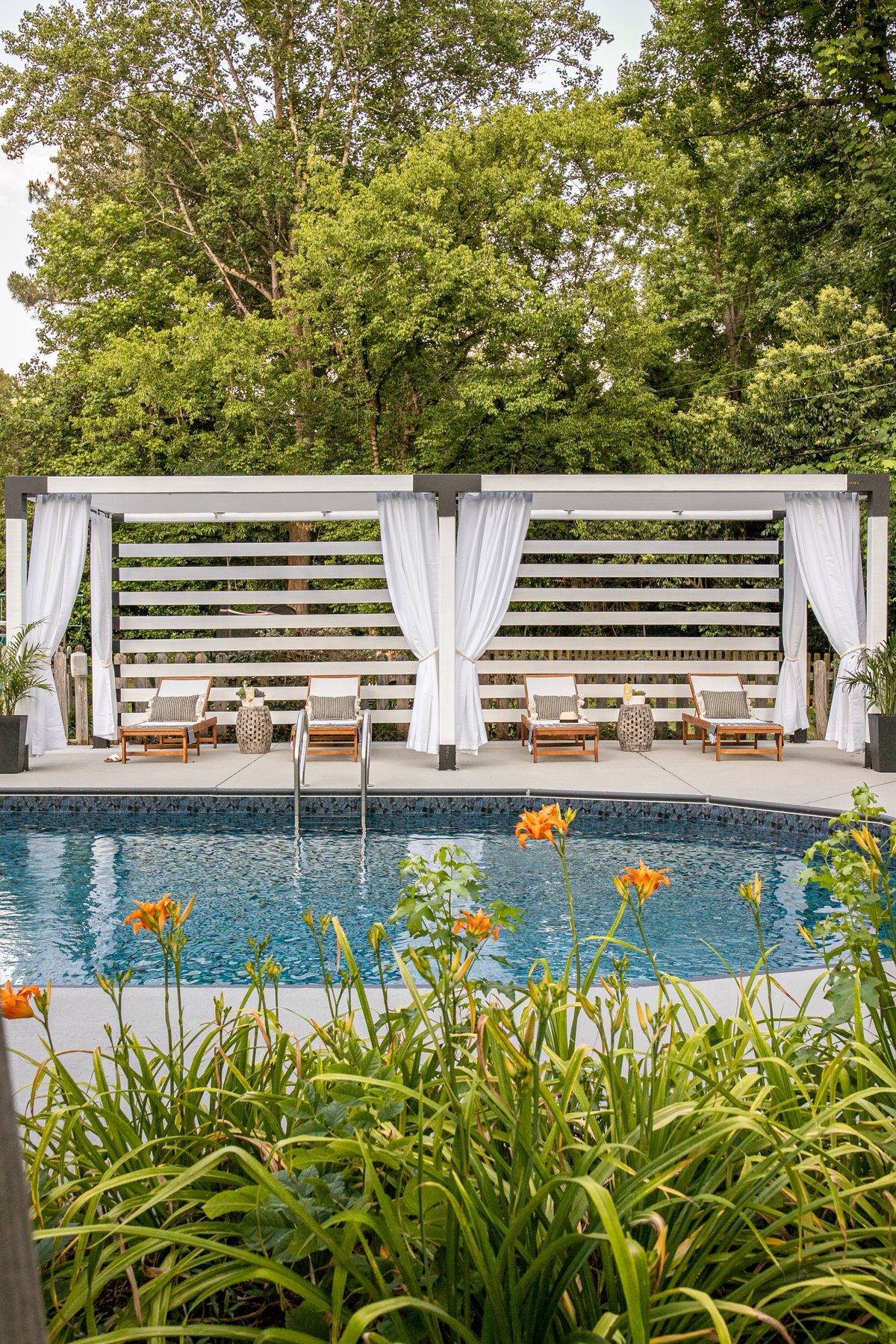 DIY cabana beside a backyard pool