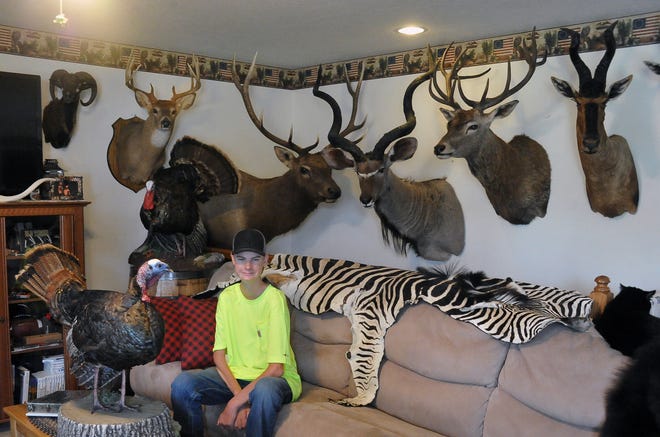 Cooper Meshew with some of the animals he has hunted over the years. He fell in love with hunting when he was just 10 years old which drew him to start his nonprofit called "Hunt for Hope."